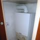 The combi-boiler in a cupboard in our bathroom, which provides all the hot water on demand for the central heating radiators and hot water taps.