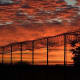 The sunset over a barbed-wire fence