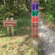 These signs are placed at major crossroads on the trails. They are pretty easy to understand, and are very visible on the trails.