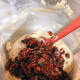 Combine the mixed fruits into the cake batter. Use a spatula to combine.