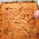 Use a skewer to poke some holes on the cake.