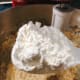 Gradually, at the flour mixture.
