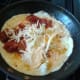 Adding grated cheese