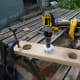 Cutting the three cable access holes in the trough side and base.