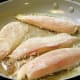 Saute and brown the tilapia on one side