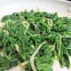 Stir until the spinach has wilted and there is no liquid left in the pan.