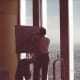 An artist painting the scene from the observation deck of the World Trade Center, New York, December 1988.
