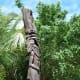traditional totem poles are dotted through the island