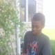 My son helping my sister in her garden.