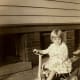My mother riding a tricycle