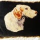 A little dog needlepoint created by my grandmother that we had remade into a pillow.