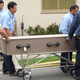 Casket is being loaded into hearse