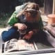 Sarah is showing one of the numerous stray cats that visited us a book about cats. One thing you will notice as you see the various pictures of Sarah from year to year is that her need to hold, pet, and be around animals is consistent. Children with