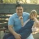 This was also at Disneyland. Sarah has come to sit on Kosta's lap. I'm not sure why now, but she often wanted us to hold her on our laps, even when she got to big to fit.