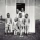 My cousins, brothers and me in the playhouse my dad built for us. This was prior to it being finished with actual windows and a door.