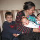 Adopted Chinese daughter comes home. Mollie is stroking the head of her adopted sister Steffi right after I first come home in 2004. Mollie is 3.