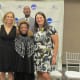 Claudette the widow of Walker pose with other recipients of the 2018 Athletics Hall of Fame awards.