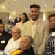 The wife of Walker along with the recipient of Walker Carter scholarship fund sponsored by PECO Energy.