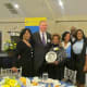 Family members gather with the President of PECO where Walker was employed as a lineman for more than 30 years.