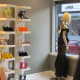 Other accessories such as shoes, handbags and scarfs are neatly displayed within Jacqueline's shop.
