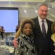 Michael Innocenzo, President of PECO appears along with the widow of Walker Claudette (on the left) and her twin sister Paulette Blake.