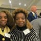 Paulette Blake along with Claudette Carter, wife of Walker share a moment of encouragement as they enjoy the award ceremony.