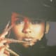 A photo of Jacqueline, is displayed within her boutique. She is married to Jahlil a Grammy Award winning artist who also owns a store downtown Chester as well.