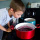 Lucas inhaling the sweet smell of the blueberries