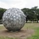 “What Goes Around, Comes Around…” by John Runnels & Tristan in the True North 2019 sculpture exhibit