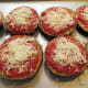 Next spread the mozzarella cheese on top of the eggplant slices.