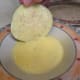 Next, dip the eggplant into the egg mixture.