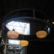 A few of the dim lights inside the restaurant.