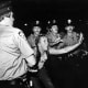 Once some patrons had been beaten and dragged into police vans, onlooking community members began to fight back.