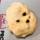 Place dough on a baking mat to deflate. Pat it into a square shape using your hands.