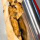 To make a braided loaf, cut the log in half crosswise using a sharp knife or dough scraper,