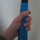 Grab the racket as if you're going to shake hands with it. This is also called the Eastern or Continental grip.