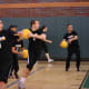 Throwing - aim low and along a diagonal. Chest-height throws straight at an opponent are easiest to catch; head height throws easy to dodge. Throw as a team at a single target to make dodging much harder.