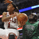 Shaquille trying to block Derrick Rose.