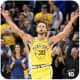Stephen Curry celebrating after making a three-point shot.
