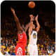 Stephen Curry shoots over James Harden of the Houston Rockets.