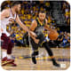 Stephen Curry driving to the basket while Kevin Love of the Cleveland Cavaliers defends.
