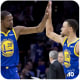 Stephen Curry high fives his teammate Kevin Durant.