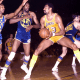 Wilt Chamberlain against multiple defenders.