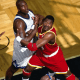 Hakeem Olajuwon fighting for the rebound.
