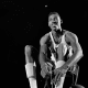 Wilt Chamberlain fixing his shoelace.