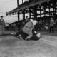 The good old days? Were people really better behaved years ago? Ebbets Field 1940. An angry Dodger fan attacks an umpire after a bitter extra inning loss to the Cincinnati Reds. This guy would be charged with terrorism today.