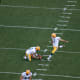 Mason Crosby practicing kicking a field goal.