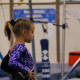 Beginning pose in Level 5 gymnastics floor routine