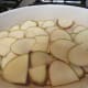 First layer of potatoes in baking dish