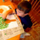 Make leaves using green paint and your child's fingerprints.
